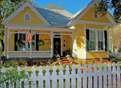 yellow house with black shutters | What a cheerful house the owners have to come home to! Yellow House Exterior, Black Shutters, Yellow Cottage, Cottages And Bungalows, Cottage Exterior, Yellow House, White Picket Fence, Victorian Cottage, Yellow Houses