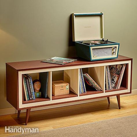 With this Ikea Kallax hack, mimic a mid-century modern classic by turning a simple shelving unit on its side, wrapping it with plywood inside and out, and attaching legs. Our materials cost was about $250. Ikea Kallax Hack, Hack Ikea, Ikea Kallax, Decor Ikea, Kallax Ikea, Vinyl Storage, Record Storage, Modern Console, Furniture Hacks