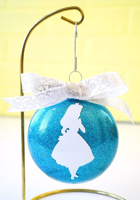 These Disney Glitter Christmas Ornaments are a super quick and easy DIY holiday decoration and gift idea! Customize with silhouettes of your favorite characters! Alice In Wonderland Tree, Christmas Tree Disney, Christmas Crafts To Sell Make Money, Disney Ornaments Diy, Diy Christmas Ornaments Rustic, Alice In Wonderland Christmas, Glitter Christmas Ornaments, Christmas Ornaments Diy Kids, Homemade Christmas Ornaments Diy