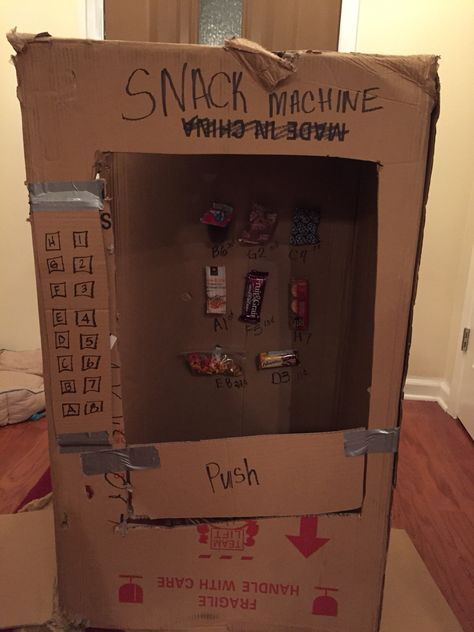 Make a snack vending machine out of a cardboard box for practicing money with the kiddos! Snack Vending Machine, Vending Machine Snacks, Vending Machine, Cardboard Box, Liquor Cabinet, Making Out, Snacks, Money, Education