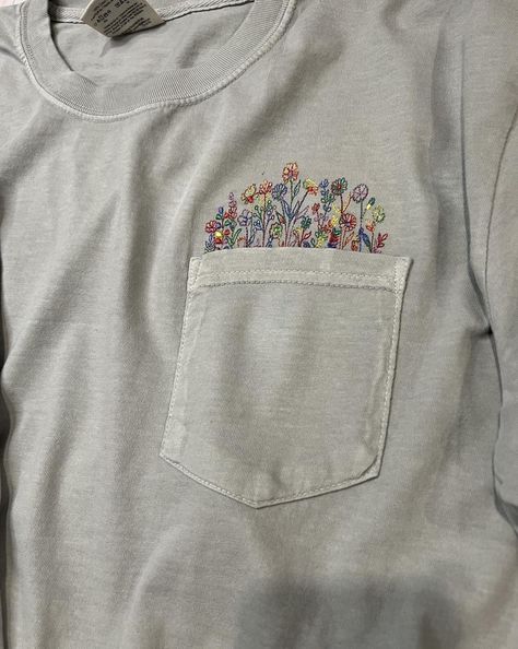 I love anything floral! This Comfort Colors pocket tee is so soft and the embroidered colorful flowers coming out of the pocket are so delicate and pretty. Other shirt colors and thread colors are also available. Please visit my Etsy shop for more. https://villageembroideryllc.etsy.com T Shirt Embroidery, Embroidery Tshirt, Thread Colors, Shirt Embroidery, Pocket Tee, Pocket Design, Coming Out, Colorful Flowers, Comfort Colors