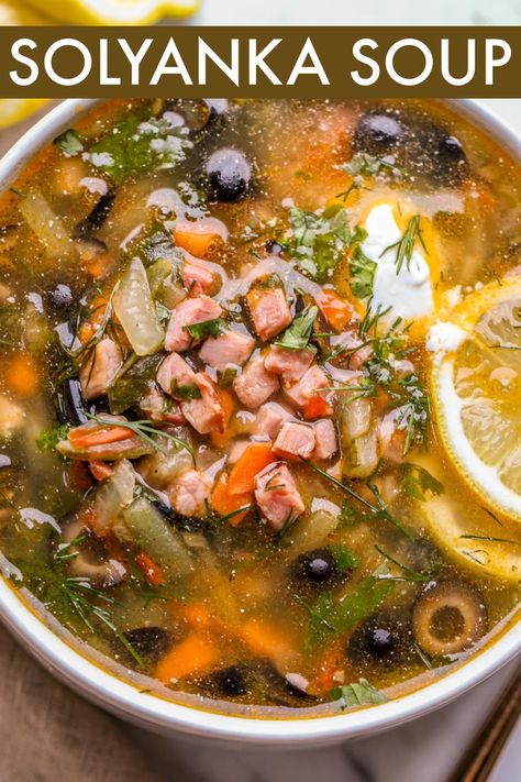 An easy Traditional Solyanka Soup Recipe. The hearty soup is loaded with ham, pickles, and olives served with fresh dill and sour cream. The soup joins our Beet Borscht for traditional Russian soup recipes. Russian Soup Recipes, Solyanka Soup, Beet Borscht, Borscht Soup, Eastern European Recipes, Beet Soup, Quick And Easy Soup, Hearty Soup, Ukrainian Recipes