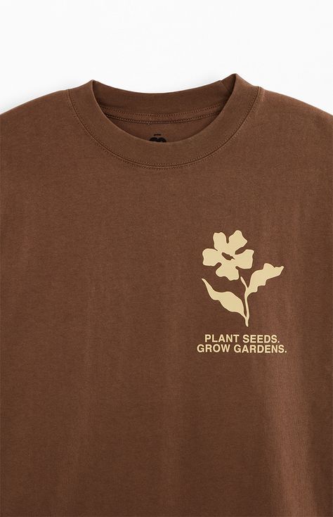 The Garden & Seeds Mission Co-Op T-Shirt blends timeless design with a distinct touch. This tee features a crew neckline, short sleeves, a standard fit, and a vintage wash, complemented by custom branding on both the front and back, making it a versatile and stylish addition to your collection.   	Crew neckline 	Short sleeves 	Standard fit 	Vintage wash 	Front & back graphics 	Machine washable Farm T Shirt Designs, Monochromatic T Shirt Design, Made In The 90s Shirt, Random Tshirt Designs, T Shirt Collage Design, Earthy Graphic Tees, Farm Inspired Outfits, Stylish Graphic Tees, Sweatshirt Merch Ideas