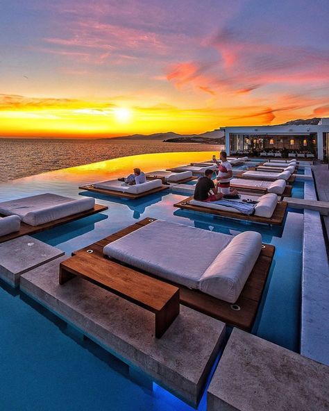 Have you been dreaming of sunsets on the beach???  Try dreaming of viewing the setting sun at the Sunset Pool at Cavo Tagoo Mykonos.  It truly is the idyllic & perfect Greek resort.  Let's plan for the not so distant future!  Contact ToaD at vacations@travelonadream.com to book a trip to Greece- because this too shall pass.  #travelonadream #ToaD #adventureawaits #Mykonos #CavoTagooMykonos #sunsetsoftheworld  📷 @cbezerraphotos Luxury Poolside, Cavo Tagoo, Best Travel Gadgets, Cavo Tagoo Mykonos, Beautiful Vacation Spots, Pool Picture, Sea Nature, Mykonos Greece, Destination Voyage