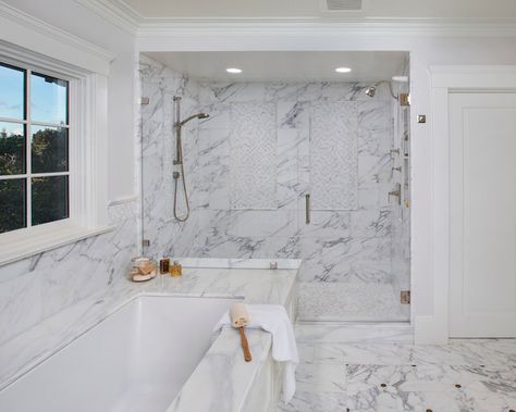 Master bathroom features shared shower with seamless glass door, his and her shower heads and white and gray marble shower surround with white mosaic marble inset tiles over white mosaic marble shower floor next to paneled drop-in bathtub with white marble surround. Shower Marble, Classic White Bathrooms, White Marble Shower, Big Shower, Mosaic Marble, Marble Showers, Double Shower, Transitional Bathroom, Shower Surround