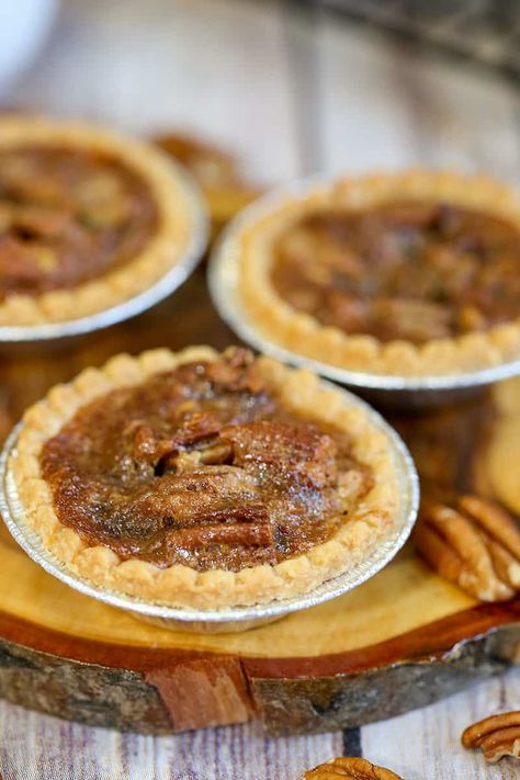 The best Canadian treat are these Maple Pecan Butter Tarts with pecans and maple syrup. These taste just like pecan pie, and is the perfect butter tart recipe. #buttertarts #maplebuttertarts #dessert #easyrecipe Pecan Butter Tarts, Maple Tarts, Best Butter Tart Recipe, Butter Tart Recipe, Pecan Tarts Recipe, Maple Syrup Recipe, Butter Tart Squares, Canadian Butter Tarts, Canadian Dessert