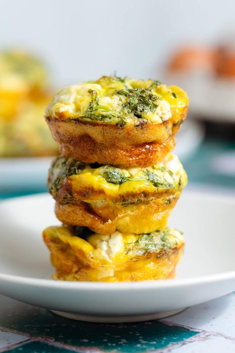 These Zucchini Egg Muffins are the perfect make ahead breakfast and they're freezer-friendly! They're made with sauteed zucchini, feta cheese, and lots of fresh herbs. The prep is super easy and you can serve them for breakfast or as a snack on-the-go. They're delicious both hot and cold, healthy, quick, and easy! Zucchini Egg Muffins, Best Workout Playlist, Salmon Pesto Pasta, Pesto Tortellini Salad, Zucchini Egg, Zucchini Cheddar, Zucchini Breakfast, Bacon Muffins, Mango Pineapple Smoothie