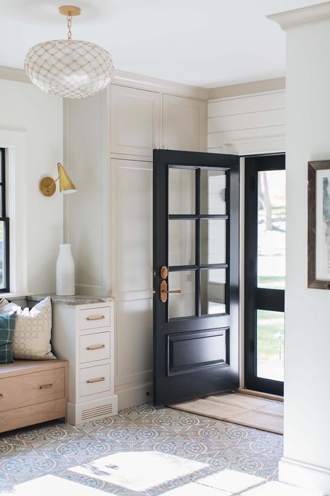 Modern Farmhouse Style-Jean Stoffer Design-24-1 Kindesign Entryway Flooring, Escalier Design, Entryway Inspiration, Farmhouse Entryway, Black Door, Entry Way Design, Laundry Mud Room, Farmhouse Style House, Modern Farmhouse Style