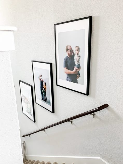 How to hang family photos going up stairwell How To Hang Gallery Wall Up Stairs, Small Foyer Ideas Entryway With Stairs, Pictures In A Stairwell, Family Photos Going Up Stairs, Pictures Going Down Stairs, 3 Picture Frames On Stairs, Picture Frames Up Stairs, Frames In Stairwell, Wall Art Going Up Stairs