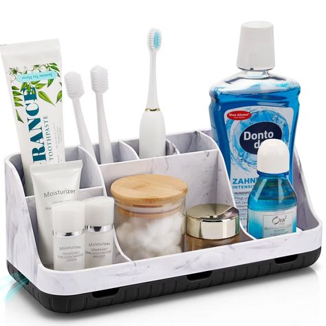 PRICES MAY VARY. SUPERIOR ORGANIZATION: The marble bathroom countertop organizer is designed with 2 tiers and 7 slots for large space. The layered divider design can separately organize bathroom accessories such as electric toothbrush, toothpaste, cosmetics, mouthwash, razor and dental floss. DETACHABLE & EASY TO CLEAN: When you need to clean it, detach the base of the marble toothbrush holder and use soapy water or water to clean the inside, simple and efficient. Bathroom organizer storage size Marble Bathroom Countertop, Bathroom Countertop Organization, Bathroom Toothbrush Storage, Bathroom Countertop Storage, Bathroom Vanity Organization, Bathroom Countertop Organizer, Bathroom Counter Organization, Kids Electric Toothbrush, Accessories Organization