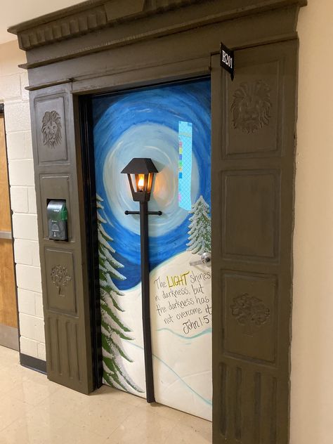 2019 Door Decorating Contest - My classroom door was transformed into a gateway to Narnia with a little help from my hubby. Wardrobe is made from foam insulation. Lamp post is project board and the bulb is wired to go down the post, under the door, and plug in on the other side. Lion Witch And The Wardrobe Classroom Door, Diy Narnia Lamp Post, Narnia Classroom Door, Narnia Bulletin Board, Narnia Door Decoration, Narnia Wardrobe Diy Cardboard, Narnia Decorations Ideas, Narnia Decorations Diy, A Christmas Carol Door Decorations