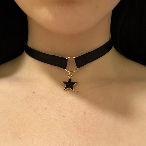 Choker is adjustable, and has a hook at the back. Introducing our celestial-inspired choker adorned with a delicate star charm, evoking the enchanting allure of the night sky. Crafted with precision and elegance, this choker gracefully encircles the neck, adding a touch of celestial glamour to any ensemble. With its subtle yet captivating design, it serves as a symbol of cosmic beauty and personal style. Elevate your look with this charming accessory that captures the magic of the stars. Star Choker Necklace, Chokers Aesthetic, Choker Necklace Black, Star Choker, Elegant Choker, Goth Choker, Choker Necklace Designs, Day Collar, Charm Choker Necklace