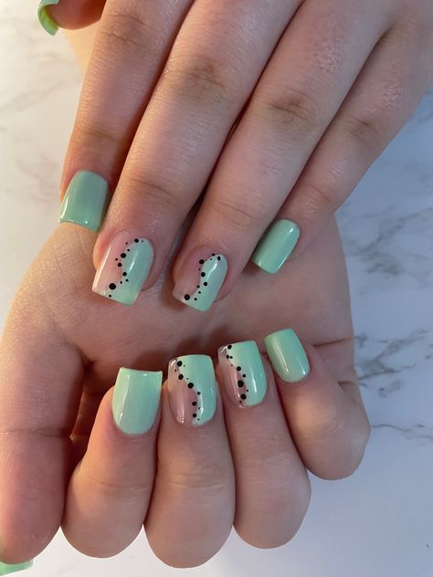 Fun design with mint green polish on half of nail separated by black dots down the middle Green Nails With Dots, Mint And Black Nails, Green Dot Nails, Mint Green And Black Nails, Green And Pink Swirl Nails, Black Dot Nails, Green Polka Dot Nails, Purple Dots Nails, Lilac Nails