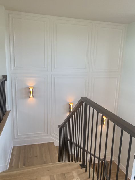 Staircase Design Between Two Walls, 2 Story Paneled Walls, Wall Paneling Up The Stairs, Wall Moulding Open Concept, Paneling In Stairwell, Wainscotting Entry Wall, Wainscoting Modern Ideas, Stairwell Wood Paneling, Foyer Wall Molding Ideas