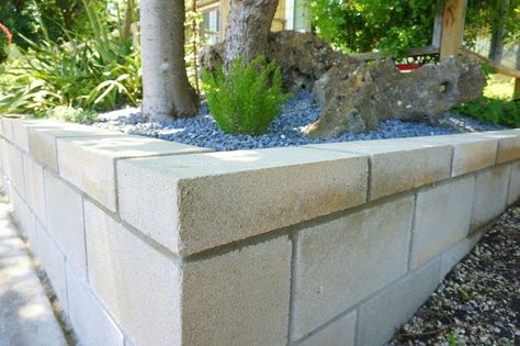 Retaining wall on a slope Cinder Block Retaining Wall, Cinder Block Garden Wall, Concrete Block Retaining Wall, Block Retaining Wall, Cinder Blocks Diy, Retaining Wall Patio, Cinder Block Furniture, Diy Retaining Wall, Retaining Wall Design