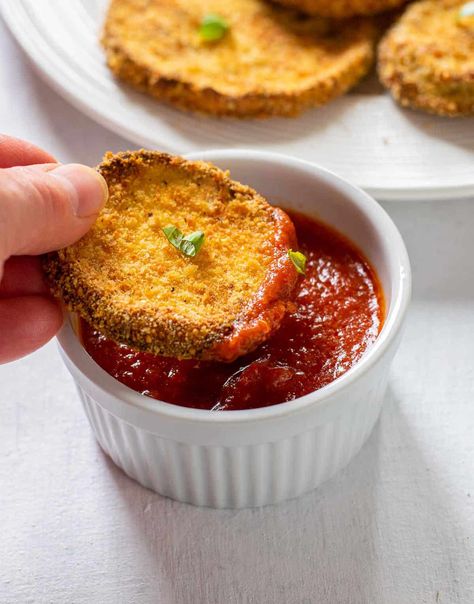 Make these Baked Breaded Eggplant Slices for a delicious appetizer, side dish or to use in recipes like Eggplant Parmigiana! You'll love this method for crispy eggplant "fried" without much oil! Romano cheese brings a nice pop of flavor. #breadedeggplant #bakedbreadedeggplant #eggplantslices Oven Fried Eggplant, Eggplant Fried, Gameday Snacks, Breaded Eggplant, Italian Thanksgiving, Eggplant Appetizer, Crispy Eggplant, Best Vegetable Recipes, Eggplant Parmigiana