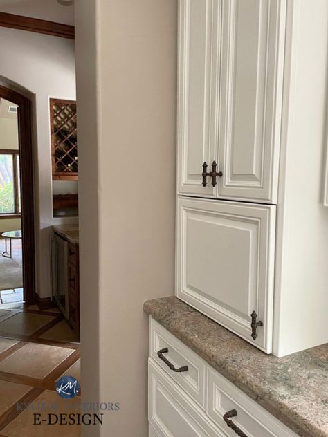 Learn about Sherwin Williams Tony Taupe, a soft beige paint colour with undertones. Shown here with older style granite countertop and Aesthetic Whtie painted maple cabinets. Kylie M Interiors Edesign, DIY update ideas #paintedcabinets #sherwinwilliams #granitecountertops #taupe #greige #kitchenideas #update #diy #interiordesign #interiordecor #homedecor #kylieminteriors #kyliemedesign #colourconsultant Tony Taupe Sherwin Williams Cabinets, Tony Taupe Sherwin Williams, Sherwin Williams Tony Taupe, Tan Kitchen Walls, Balanced Beige Sherwin Williams, Taupe Aesthetic, Tony Taupe, Hall Paint Colors, Taupe Bathroom