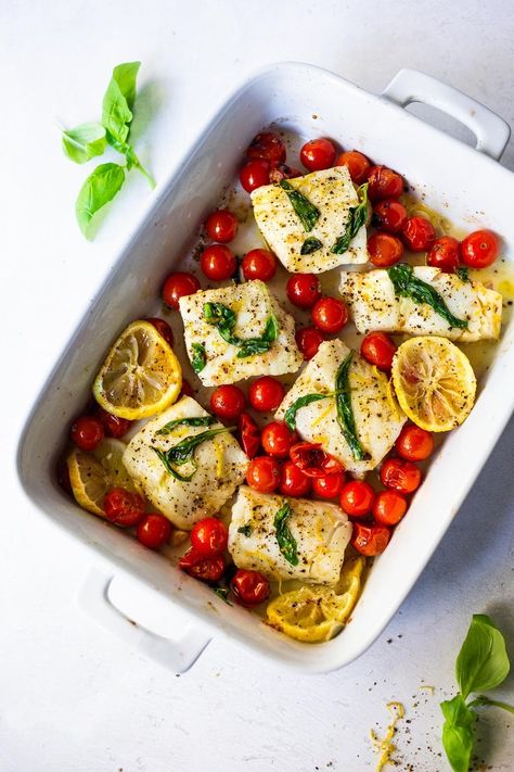 Simple Baked Cod with Tomatoes, Basil, Garlic and Lemon- a fast and easy weeknight dinner that is healthy and delicious! Keto and Gluten-free. #bakedcod #ketomeals #easyketorecipes #weeknightdinners #healthycodrecipes #bakedcodrecipes Baked Cod With Tomatoes, Cod With Tomatoes, Cod Recipes Healthy, Best Fish Recipes, Roasted Cod, Baked Cod Recipes, Healthy Weeknight Dinners, Easy Fish Recipes, Baked Cod