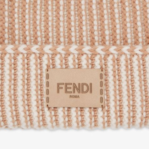 Beanie with turned-up brim. Made in a two-tone beige wool jersey distinguished by a ribbed motif that recalls the iconic Selleria stitching. Embellished with a tone-on-tone Fendi Roma label in leather. Made in Italy Wool Beanie, Wool Hat, Two Tone, Fendi, In Italy, Stitching, Italy, Wool, Hats