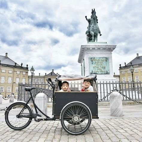 "Once they saw the Christiania bike, they immediately cheered up" #together By @bumble_bee_mum "It was not just a novelty to them, it was extremely practical! The kids could eat & sleep inside, and it kept them sheltered from the cold wind and rain. So our initially crappy day in rainy Copenhagen turned into an awesome day thanks to this Christiania bike." Christiania Bike, Crappy Day, Bike Fashion, Industrial Estate, Wagon Cart, Cargo Bike, Uk London, Wind And Rain, North South