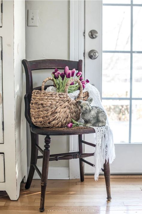 brown antique chair, basket, lace throw, tulips, cement bunny Indoor Spring Decor, Simple Spring Decor Living Room, Shabby Chic Spring Decor, Cottage Easter Decor, Spring Farmhouse Decor Living Room, Spring Vignettes Display Ideas, Spring Cottage Decor, Spring 2023 Decor, Spring 2023 Home Decor