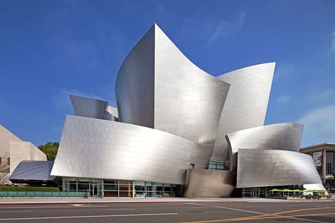 Walt Disney Concert Hall – Los Angeles Gehry was shortlisted to devise a new home for the Los Angeles Philharmonic in 1988; the project, the Walt Disney Concert Hall, finally opened in 2003. Today critics and the public agree that the iconic building was worth the wait. inside, similarly shaped panels of Douglas fir line the auditorium.  Photo: JRC/Alamy Frank Gehry Architecture, Gehry Architecture, Deconstructivism, Walt Disney Concert Hall, Vitra Design Museum, Rem Koolhaas, Vitra Design, Frank Gehry, Amazing Buildings