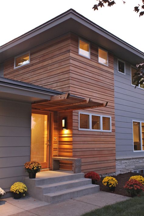 We remodeled this entire home, keeping only a few walls to comply with setback requirements.  The exterior is a combination of clear shiplap cedar, stone, aluminum and Hardie Plank siding. 70s Architecture, Hardy Plank Siding, Wood Siding Exterior, Siding Ideas, Cypress Grove, Home Exterior Makeover, Cedar Siding, Exterior Makeover, Exterior Remodel