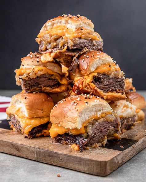 These roast beef and cheddar sliders are the perfect appetizers. Piles of roasted beef, melted cheddar, and caramelized onions. Roast Beef And Cheddar Sliders, Beef And Cheddar Sliders, Beef And Cheddar, Roast Beef And Cheddar, Sliders Recipes Beef, Tender Roast Beef, Rolled Roast, Cheddar Cheese Recipes, Cheeseburger Sliders