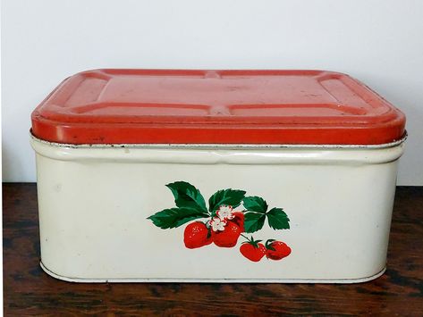 Vintage 1950s Strawberry Decorated Tin Bread Box. Unmarked,  based on my research it was manufactured by Parker Metal Decorating Company of Baltimore, Maryland. Hinged Lid, charming design. Rare and hard to find. Approx 14 in long × 10 in wide × 6 1/4 in tall. Very good vintage condition for the age. Clean inside, shows wear, chippy paint and minor dents. The patina adds to the vintage charm. Lid works as it should. See pics as they are part of the description.  * Please note: Vintage items,  by nature,  are likely to carry various marks and indications of their age. I make every effort to photograph my items to show all features and characteristics as clearly as possible.  All vintage items are in used condition and are sold as is. All sales final. Vintage Strawberry Kitchen, Decorated Bread, Strawberry Elephant, Decorate Bread, Strawberries Recipes, Strawberry Decor, Vintage Kitchen Accessories, Vintage Bread Boxes, Strawberry Kitchen