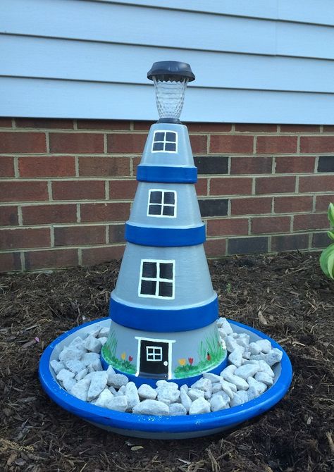 Terra Cotta Clay Pot Lighthouse Diy Lighthouse, Clay Pot Lighthouse, Diy Terra Cotta Pots, Lighthouse Crafts, Solar Light Crafts, Lighthouse Decor, Clay Pot Projects, Flower Pot People, Terra Cotta Clay Pots