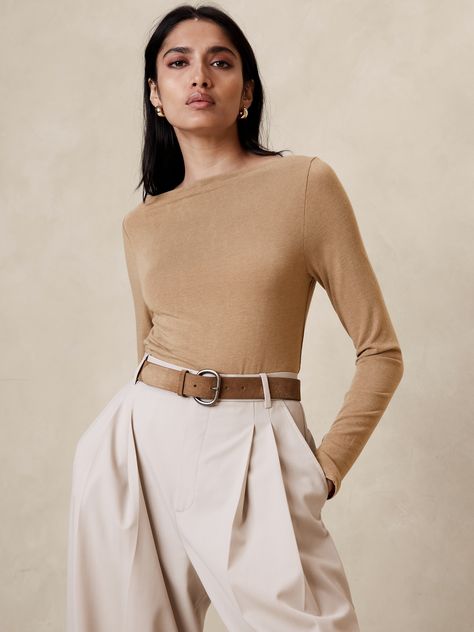 A simple luxury, this sleek boat-neck top is made of a soft wool jersey blend with a flattering boat neck.  Fitted.  Boat neck.  Straight hem.  Fitted.  Long sleeves.  Hip length.  Model: Size S, 5'10" (178cm). Lirika Matoshi, Boat Neck Shirt, Boat Neck Blouse, Simple Luxury, Top Banana, Boat Neck Tops, Paris Outfits, Blouse Designs Latest, Banana Republic Women