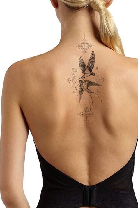 Learn the swallow tattoo meaning, its belonging to different cultures, and to whom such a design will suit the most. Bonus: the best unique designs inside. Back Tattoo Birds Women, Sparrow Tattoo Women, Feminine Swallow Tattoo, Elegant Bird Tattoos, Back Tattoo Women Bird, Bird Back Tattoos For Women, Birds Back Tattoo, Back Bird Tattoo, Timeless Tattoos For Women