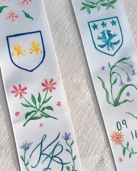 Commissioned hand-painted ribbon for the brides wedding bouquet featuring the couples family crests and florals 😍 #illustratedwedding #illustration #handpainted #bespoke #bespokewedding #weddingboquet #weddingflowers #bridalflowers #wedding #weddingstationery #bespokeweddingstationery #weddingdetails #bride #bridetobe #ribbon #luxury #luxurywedding #smallbusiness #weddingsupplier #weddingvenor #2025bride #20204bride #weddinginspo Bespoke Wedding Stationery, Wedding Bouquets Bride, Family Crests, Bespoke Wedding, Family Crest, Wedding Bouquet, Luxury Wedding, Wedding Details, Wedding Inspo