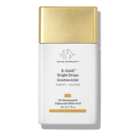 Add a touch of golden radiance to skin with the Drunk Elephant B-Goldi Bright Drops, a serum that helps fade spots and hyperpigmentation. Gold Drops Drunk Elephant, Drunk Elephant Goldie Drops, Drunk Elephant Gold Drops, Drunk Elephant Drops, Drunk Elaphant, Drunk Elephant Bronze Drops, Hue Drops, Drunk Elephant Products, Dream Skincare