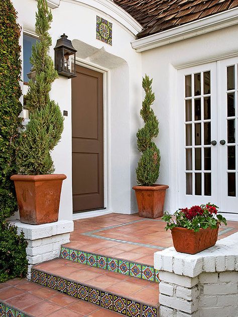 An entryway is a prime location to splurge on gorgeous features, such as the wooden front door or colorful step tiles seen here: http://www.bhg.com/home-improvement/exteriors/curb-appeal/enhance-front-entry/?socsrc=bhgpin053014addpersonality&page=4 Front Door Steps, Tile Steps, Porch Tile, Outdoor Entryway, Exterior Stairs, Tile Stairs, Front Entryway, Wooden Front Doors, Porch Steps