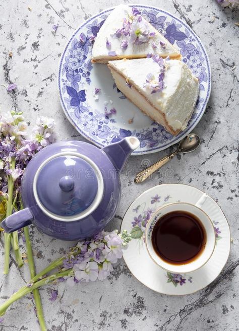 Still life with black tea and cheese cake, spring bouquet,delicate lilac flowers. Still life with black tea and cheese cake, spring bouquet of delicate lilac royalty free stock photography Tea Still Life Photography, Cheese Background, Tea Party Photography, Cake Spring, Tea Photography, Cake Photography, Still Life Photos, Spring Bouquet, Cake Slice