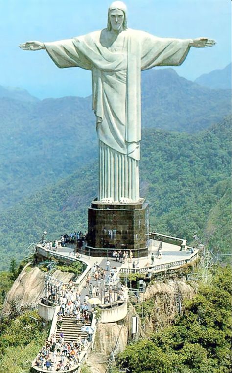 This giant image representing Jesus Christ has become one of the biggest postcards in Brazil and Rio de Janeiro. Being a symbol of Christianity in Brazil, in 2006 Christ the Redeemer was transformed into a Catholic sanctuary, the following year, in 2007, the monument was elected one of the seven wonders of the modern world. #brazil#riodejaneiro Christ The Redeemer Brazil, Brazil Travel Guide, Jesus Background, Christ The Redeemer Statue, Famous Monuments, Christ The Redeemer, Brazil Travel, Jesus Christ Images, Destination Voyage