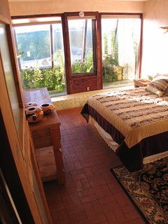 Earthship Bedroom, Earthship Greenhouse, Earthship Design, Earth Ship, Brick Floors, Brick Floor, Eco Homes, Earthship Home, Natural Homes