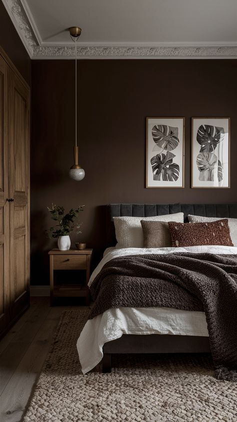 22 Cozy and Modern Brown Bedroom Ideas: Aesthetic Designs with Dark, Beige, and Green Accents Bedroom Color Schemes Dark Wood, Brown Walls Master Bed, Dark Cozy Master Bedrooms Decor, Dark Plum Bedroom Walls, Dark Chocolate Paint Color, Dark Chocolate Walls, Chocolate And Cream Bedroom Ideas, Brown Wall Bedroom Ideas Cozy, Dark Brown Master Bedrooms Decor