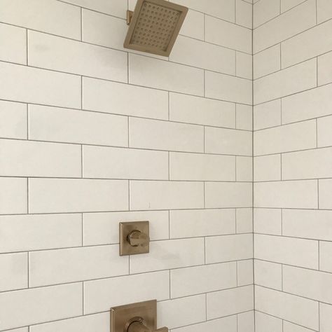 Delta shower fixtures in Champagne Bronze and 4x12” white subway tile in shower 4 X 12 Subway Tile Showers, 4x12 Subway Tile Bathroom Showers, 4x12 Subway Tile Bathroom, Delta Shower Fixtures, White Subway Tile Shower, White Subway Tile Bathroom, Delta Shower, Farmhouse Bathrooms, Bathroom Beautiful