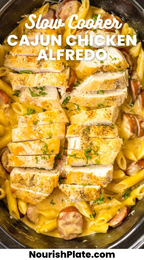 This Creamy Slow Cooker Cajun Chicken Alfredo is the perfect meal for feeding a crowd. Loaded with tender chicken, smoky sausage, and a rich Cajun sauce, it's sure to become a family favorite! Cajun Crock Pot Recipes, Crockpot Family Meals, Slow Cooker Cajun Chicken Alfredo, Cajun Chicken Alfredo Recipe, Pot Roast Soup, Family Meals Crockpot, Roast Soup, Slow Cooker Cajun, Alfredo With Sausage