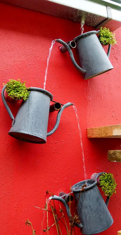 Fantastic cascading watering can feature. Great way to create a decorative drainage system from the gutter. Taman Air, Rain Chains, Watering Cans, Rain Chain, Garden Crafts, Watering Can, Outdoor Projects, Water Garden, Dream Garden