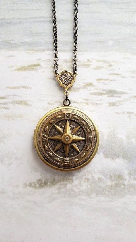 Compass Locket Necklace ☻Locket ~ Round Bronze ~ With Compass ~ See Photos for size comparison against American quarter Chain: ~ Antique Bronze YOU CHOOSE YOUR CHAIN LENGTH during checkout ☻More Lockets Here: https://www.etsy.com/shop/FashionCrashJewelry/search?search_query=lockets&order=date_desc&view_type=gallery&ref=shop_search ☻Link to The ENTIRE SHOP: https://www.etsy.com/shop/FashionCrashJewelry?ref=shopsection_shophome_leftnav&ga_search_query=crystal%2Bnecklace Our Motto ~ Happy Customers Locket Necklace Men, Locket For Men, Compass Necklace Aesthetic, Vintage Gold Necklace With Compass Design, Compass Design Medallion Locket Necklace As Gift, Compass Locket, Compass Design Locket Necklace As A Gift, Compass Necklace Vintage, Vintage Round Compass Pendant Jewelry