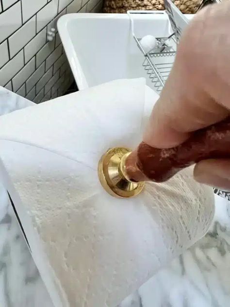 Pressing an embossing tool into the end of a roll of toilet paper. Embossed Toilet Paper, Toilet Paper Embossing, Toilet Paper Stamping, Toilet Paper Folding Ideas, Toilet Paper Stamp, Toilet Paper Origami, Best Toilet Paper, Hotel Cleaning, Jetted Bath Tubs