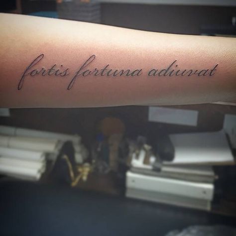 Latin phrase "Fortis Fortuna Adiuvat" tattoo, which literally translates to Fortune Favors the Bold, located on the left forearm. Fortis Fortuna Adiuvat Tattoo, John Wick Tattoo, Fortis Fortuna Adiuvat, Fibonacci Tattoo, Tattoo Font For Men, Forearm Tattoo Quotes, Small Forearm Tattoos, Fortune Favors The Bold, Tattoo Font