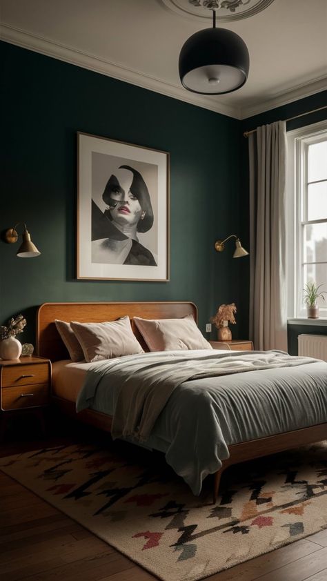 This stunning mid-century modern bedroom is the epitome of chic and cozy. The deep green walls create a dramatic backdrop for the statement bed, with its walnut headboard and plush bedding. A vintage-inspired rug adds warmth and texture to the space, while a pair of brass sconces and a modern chandelier provide ample lighting. The finishing touch is a large framed print of a glamorous woman, adding a touch of Hollywood Regency style to the room. Bancha Green Bedroom, Art Deco Mid Century Modern Bedroom, Olive Bedroom Aesthetic, Bedroom With Walnut Bed, Dark Green Bedroom Moody, Mid Century Headboard Ideas, Walnut Bed Frame Bedroom Ideas, Hunter Green Room Ideas, Green And Mahogany Bedroom