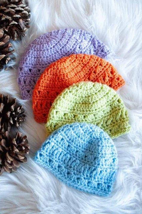 Use this free pattern to make a lace crochet hat for babies. The lacey hat is lightweight enough to provide just a little extra warmth on chilly days. The lace stitches add visual interest to this pretty design. And, the hat is quick to make. You can have a new baby gift ready in just a couple of hours. #crochet #crochetbabyhat #freecrochetpattern Baby Beanie Crochet Pattern, Crochet Baby Hats Free Pattern, Crochet Baby Cap, Baby Hat Free Pattern, Crochet Newborn Hat, Crochet Baby Bonnet, Crochet Baby Hat, Crochet Baby Beanie, Crochet Baby Hat Patterns