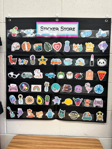 Pocket chart with prize stickers. Incentives For Elementary Students, Sticker Store Classroom Middle School, Sticker Shop Classroom, 3rd Grade Incentives, Sticker Rewards Classroom, Elementary Prize Box Ideas, Class Sticker Store, Classroom Incentives Kindergarten, Classroom Candy Jar Ideas