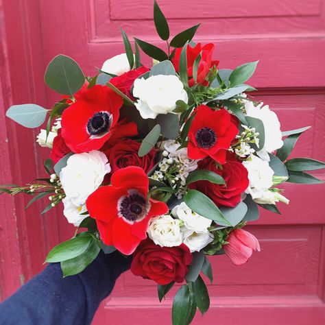 Red anemones, white ranunculus, red roses, waxflower, and greenery bridal bouquet Hoco Flowers Bouquet For Red Dress, Prom Bouquets For Red Dress, Red And White Bridal Bouquet, Red Poppies Bouquet, Poppy And Rose Bouquet, Rose And Poppy Bouquet, Red Prom Bouquet, Red Poppy Bouquet, Red And White Bouquet