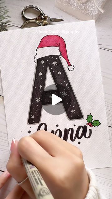 Nhuan Dao✨Calligraphy & Lettering❤️ on Instagram: "✍️ Write Your Name in Festive Christmas Style! 🌟
.
.
.
🌟FREE Gift For You:
Do u Want to Try Your Hand at Brush Lettering and Calligraphy? Download This FREE WORKSHEET : “Master 8 Basic Stroke Of Brush Lettering” For Beginners
👉You Can Find The Link in My Bio or Visit: nhuandaocalligraphy.com
.
.
.
#NhuanDaoCalligraphy #namelettering #Calligraphy
#BrushLettering #ModernCalligraphy #HandLettering #Lettering #Handwriting #Writingname #WriteYourName
#Gift #DIY #artreels #reels" Diy Christmas Cards Calligraphy, Christmas Letter Ideas Writing, Christmas Lettering Ideas, Christmas Santa Drawing, Simple Christmas Drawing Ideas, Christmas Doodle Art, Simple Christmas Card Ideas, Christmas Gift Drawing, Christmas Hand Lettering